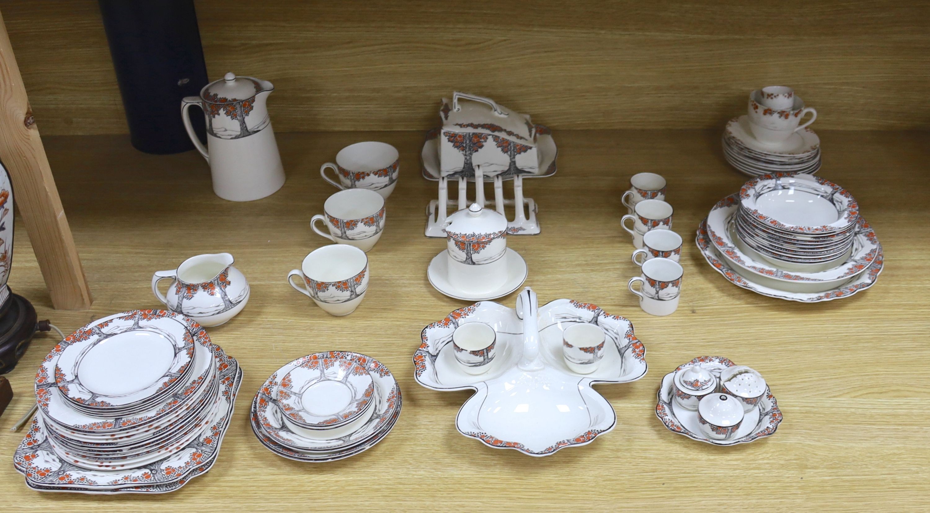 A Crown Ducal Art Deco 'Orange Tree' breakfast, tea and coffee service, to include a biscuit barrel, cheese dish and toast rack